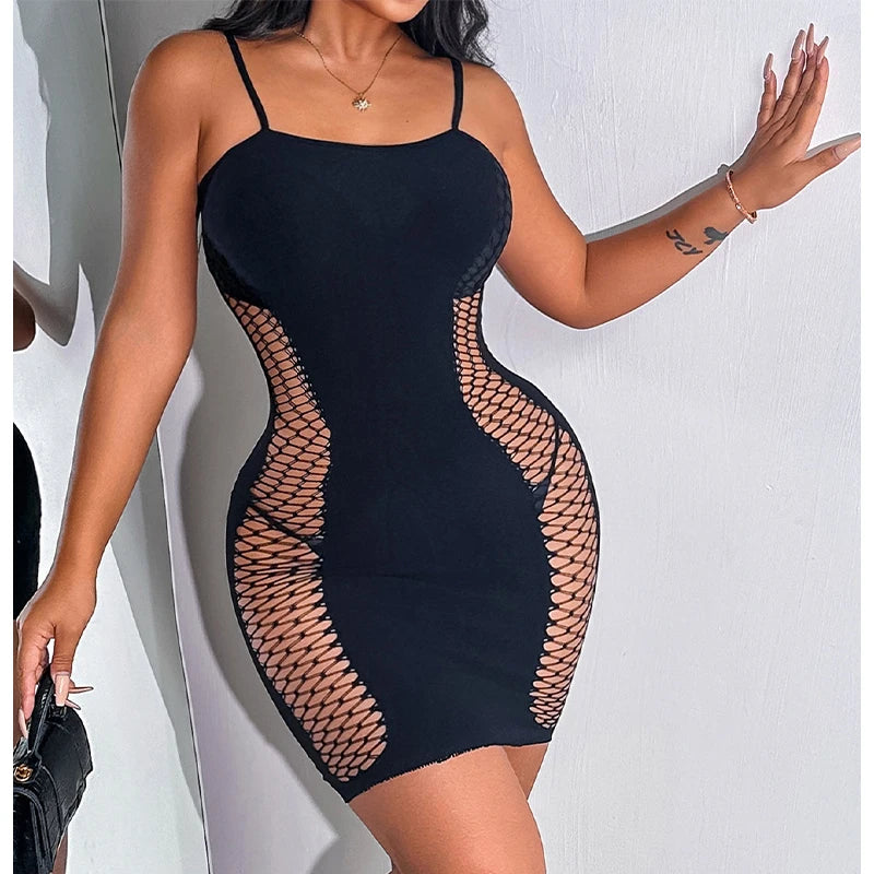Black dress with mesh panels worn by a model against a white background