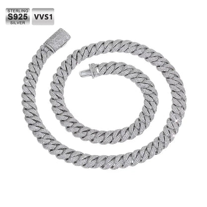 Sterling silver Cuban link chain necklace coiled on a white background, featuring a textured pavé-set appearance and a lobster clasp. Text overlays in the top-left corner read 'STERLING S925 SILVER' and 'VVS1'.