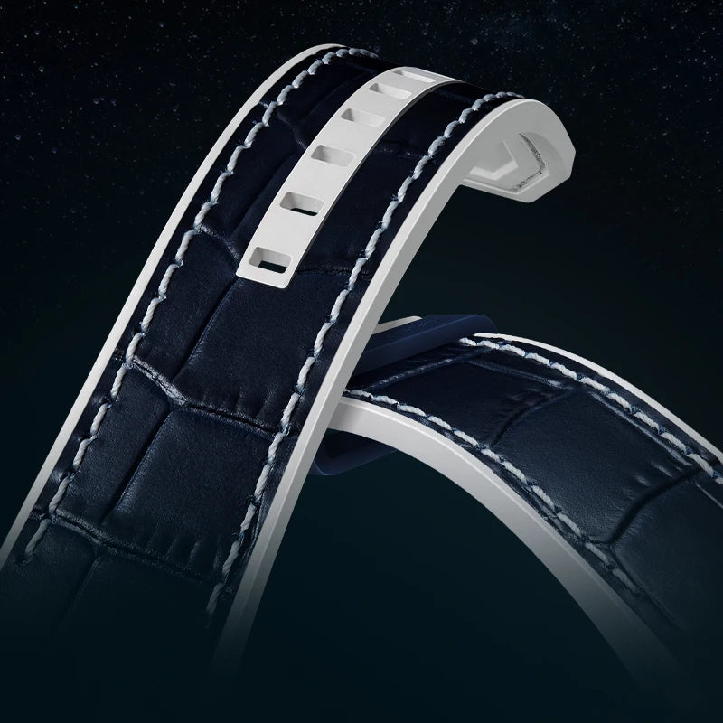 Close-up of a dark blue leather watch strap with white stitching on a black background