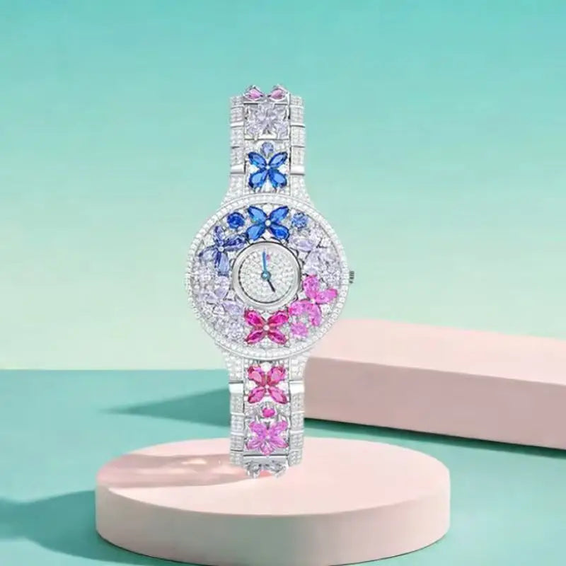 Decorative watch with butterfly designs on a light green background