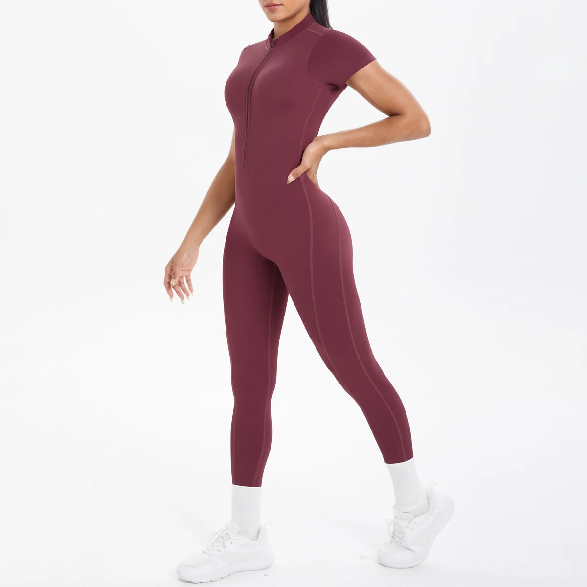 Maroon jumpsuit worn by a person on a white background