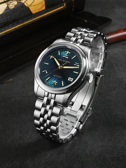 Silver wristwatch with blue dial on a dark surface