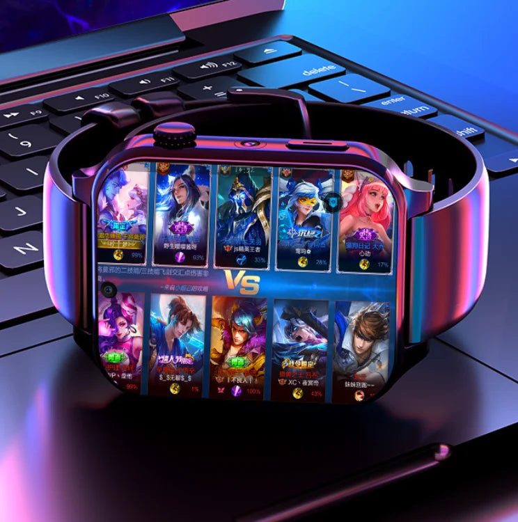 A futuristic smartwatch with a metallic magenta and blue gradient band, resting on a black laptop keyboard. The watch face displays a colorful mobile game battle interface with character cards and a 'VS' center logo.