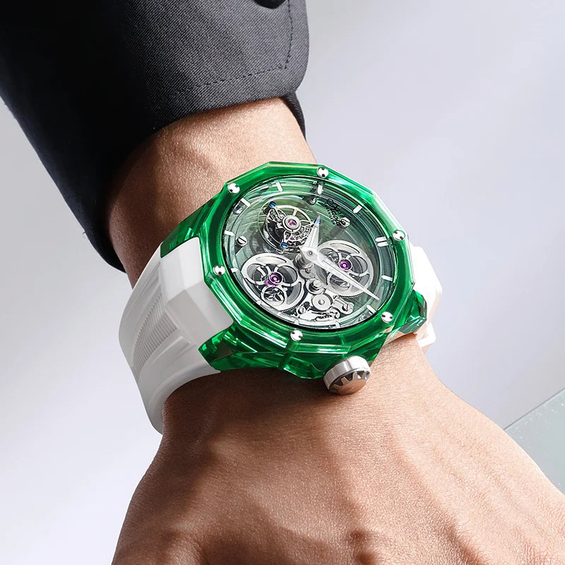 Green and white watch on a wrist with a gray background