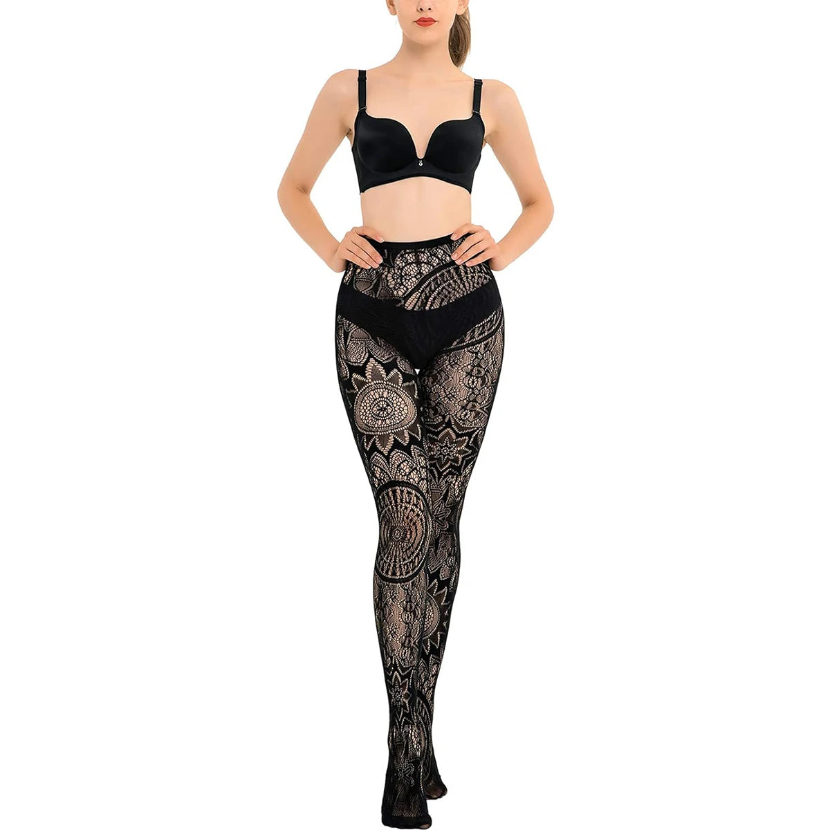 Woman wearing black patterned leggings and a matching top on a white background