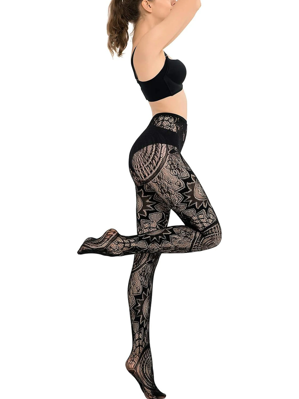 Person wearing black patterned leggings and a black top on a white background