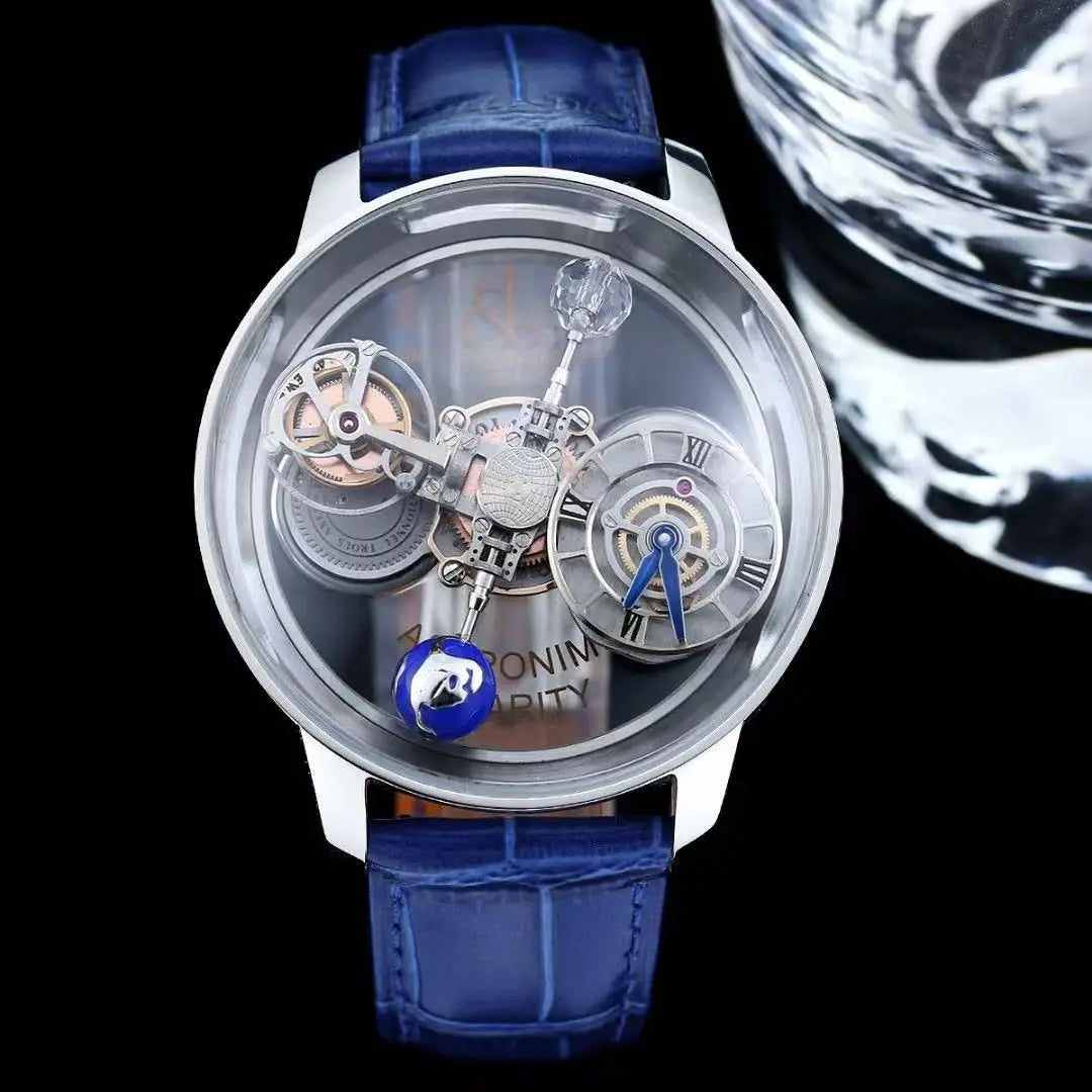 A luxury skeleton watch with a blue leather strap, silver-toned case, and intricate mechanical movement visible through a clear round dial, set against a black background with a glass prop.