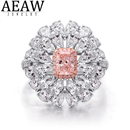 AEAW Jewelry ring featuring a central peach-colored cushion-cut diamond surrounded by a halo of clear round and marquise-cut diamonds in a silver-toned setting, shown on a white background.