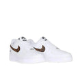 A pair of white Nike Air Force 1 Low sneakers with brown and black leopard print Swooshes, shown against a plain white background.